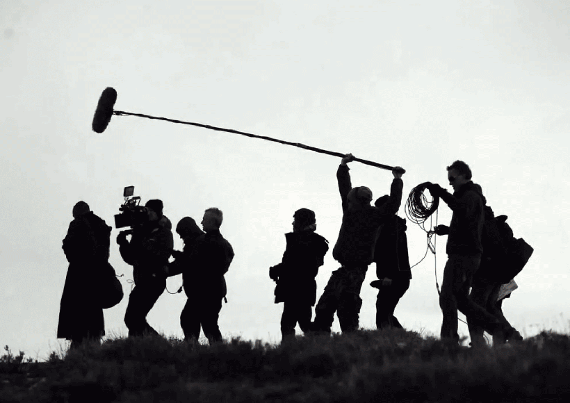 group-of-young-businesspeople-with-laptop-working-8SHTZUN
